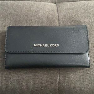 Black Micheal Kors wallet.